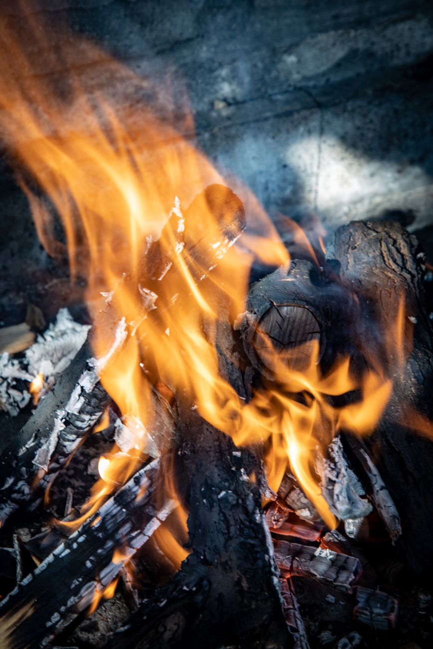 a fire is burning in the background with the words bonfire